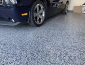 garage floor with navy car