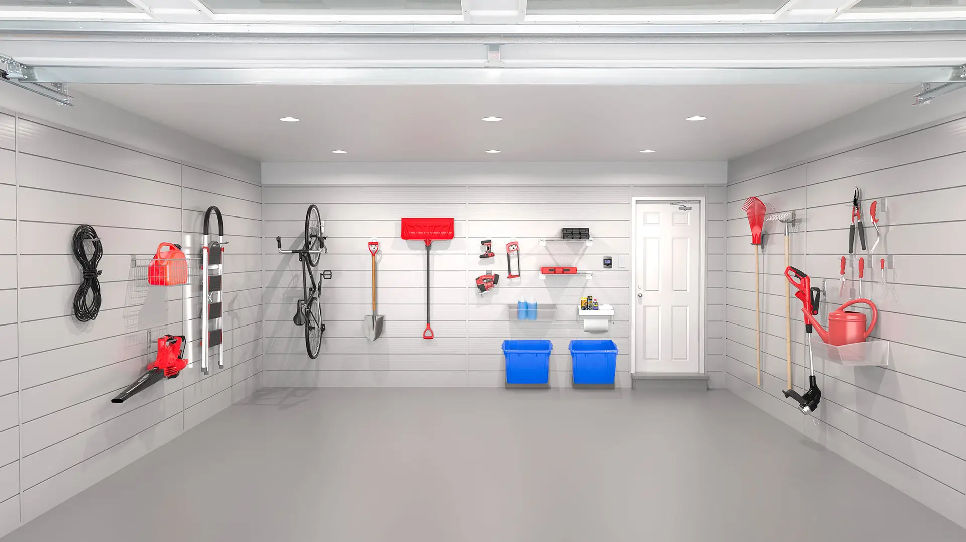 A well-organized garage interior with wall-mounted storage solutions. Various tools, including a shovel, rake, and garden hose, are neatly hung. Two blue bins are placed under a shelf, and a bicycle is mounted on the wall. The white door is seen at the back.