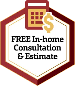A hexagonal badge with a maroon border containing a calculator and a dollar sign icon at the top. The text inside reads, "FREE In-home Consultation & Estimate" in bold black letters on a white background.