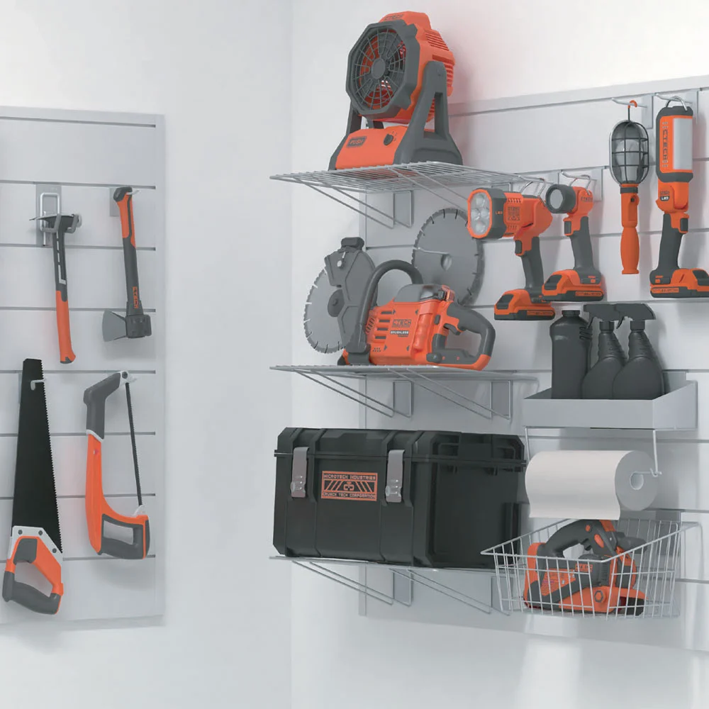A wall-mounted garage storage solution holding various orange and black power tools, hand tools, a toolbox, safety gear, a fan, and a roll of paper towel organized neatly on shelves and hooks.