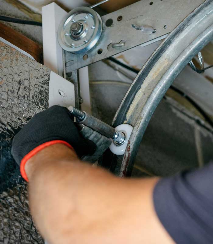 a Garage Kings Technician Replaces A Garage Door Roller