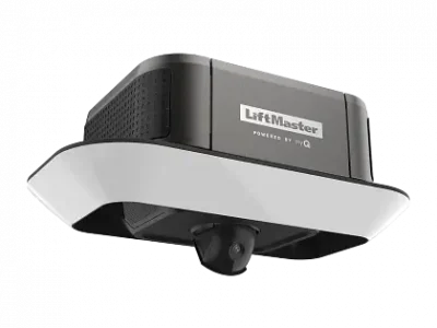 A LiftMaster garage door opener with a sleek, modern design is shown. It features a black and white body with a built-in security camera. The brand name "LiftMaster" is visible on the front of the device.
